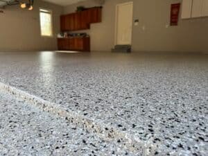 Basement floor coated with polyaspartic flake system in Lancaster PA home