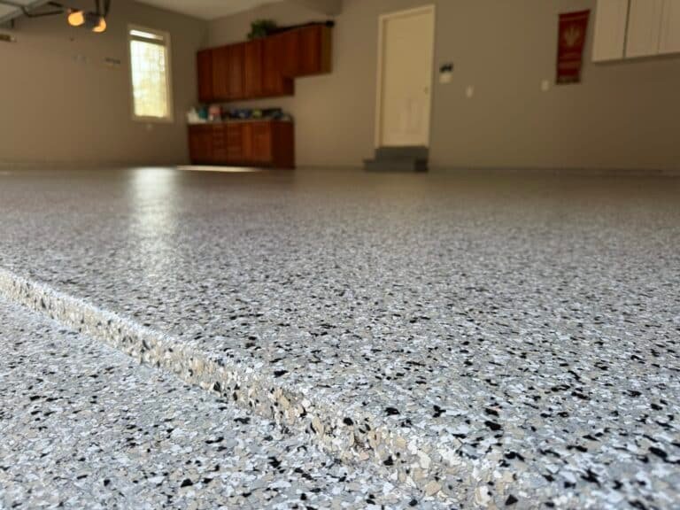 Basement floor coated with polyaspartic flake system in Lancaster PA home
