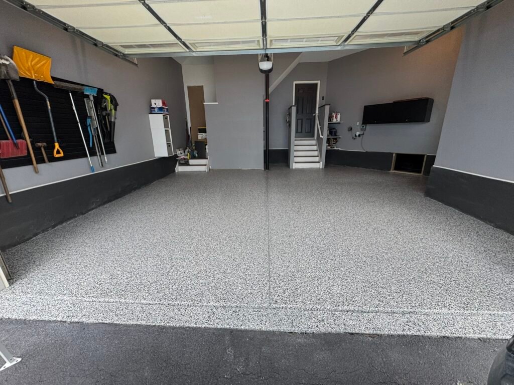 Premium polyaspartic garage floor coating in a Lancaster PA home installed by FlakePro Coatings.