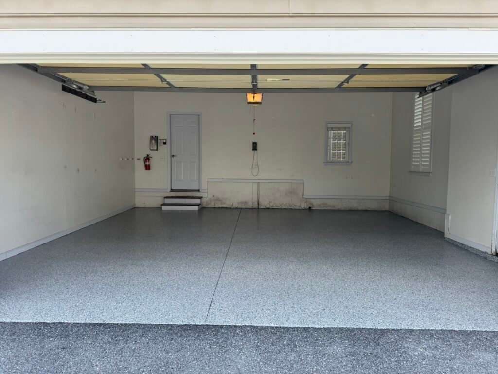 Blue, gray and white flake polyaspartic garage floor coating after installation
