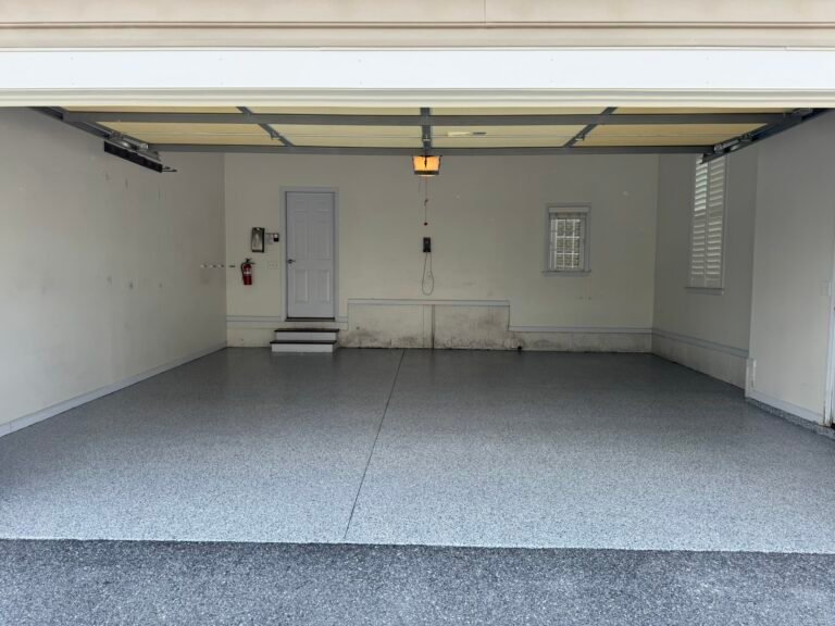 Blue, gray and white flake polyaspartic garage floor coating after installation