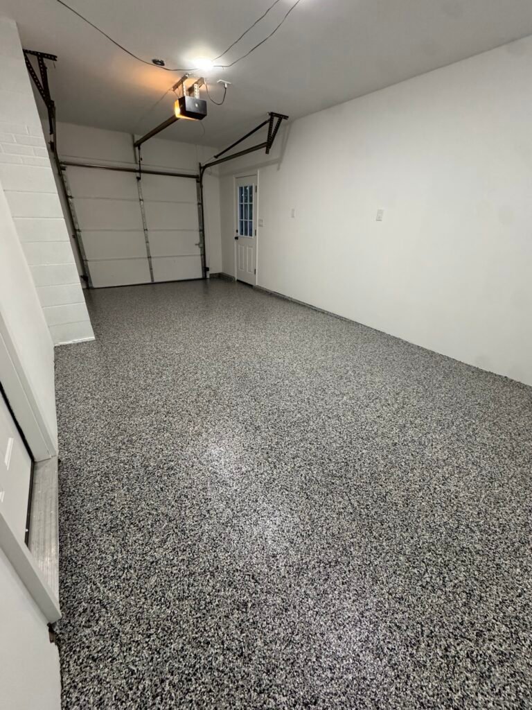 Black, gray and white flake garage floor coating, angled view