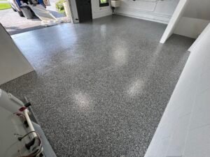 Dark gray, black and white flake garage floor coating, wide view