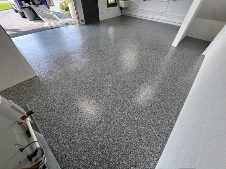 Dark gray, black and white flake garage floor coating, wide view