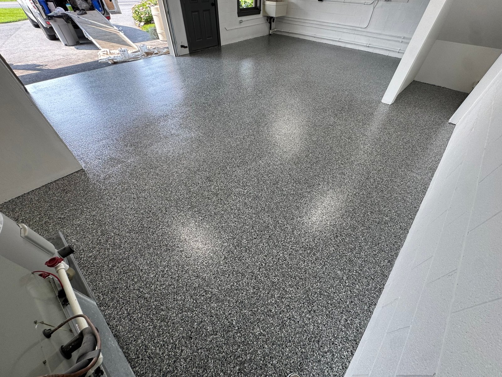 Dark gray, black and white flake garage floor coating, wide view