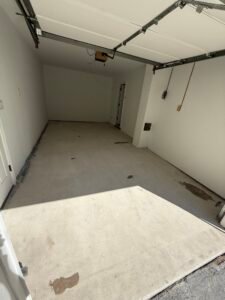Bare gray concrete garage floor before polyaspartic coating