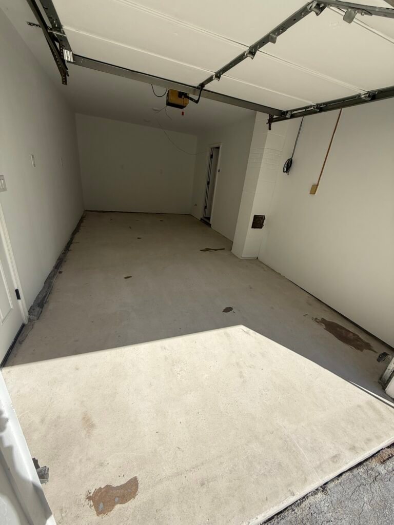 Bare gray concrete garage floor before polyaspartic coating