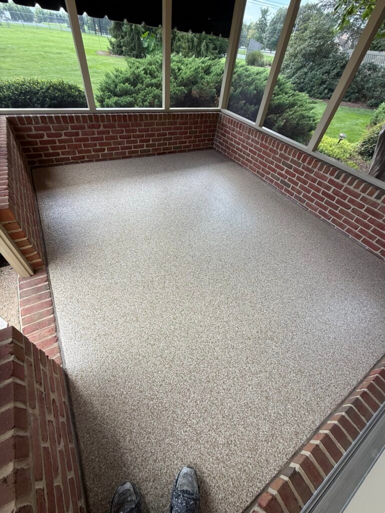 Tan, beige, black and white flake screened porch floor coating, wide view of backyard